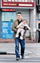 Chinese father carries his young son, Chongqing, China